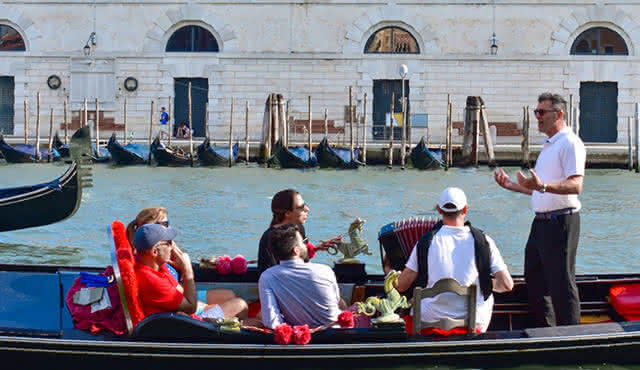 Gondola Serenade along the Grand Canal and romantic Canals wearing your Carnival Mask